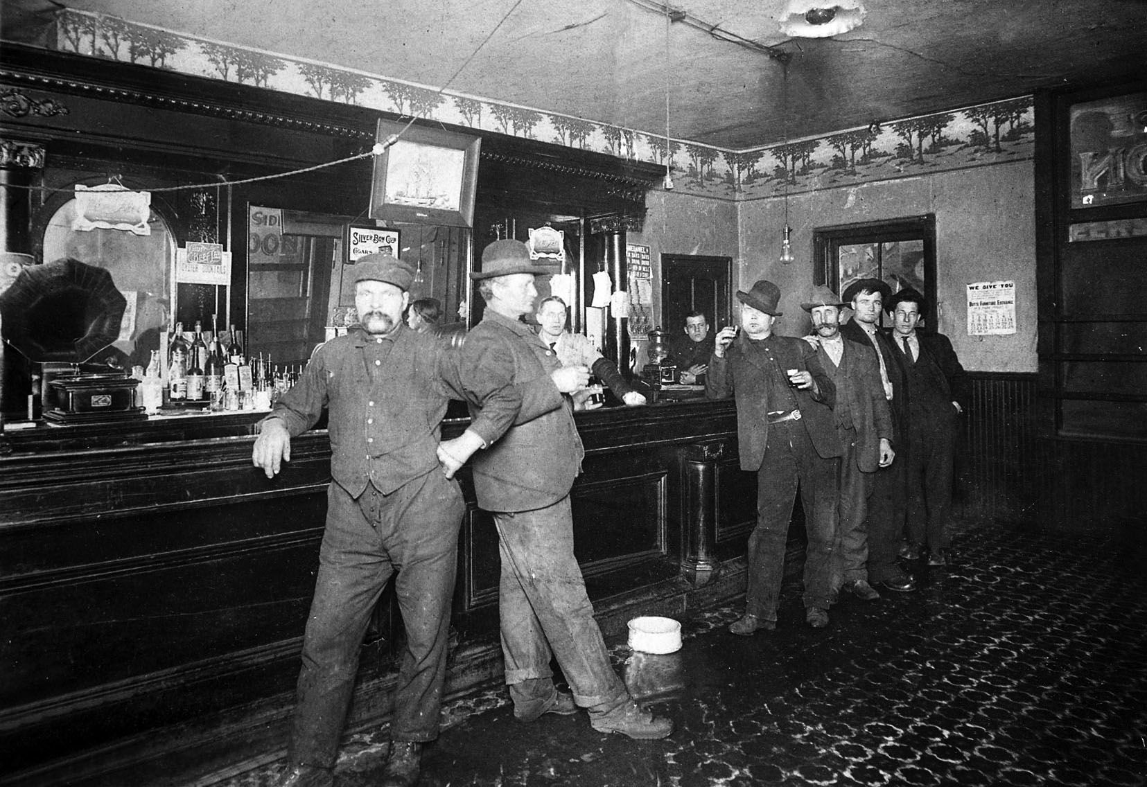 Early day miners in bar Smithers